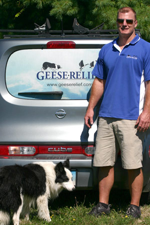 Photo of the owner and one of his four legged employee